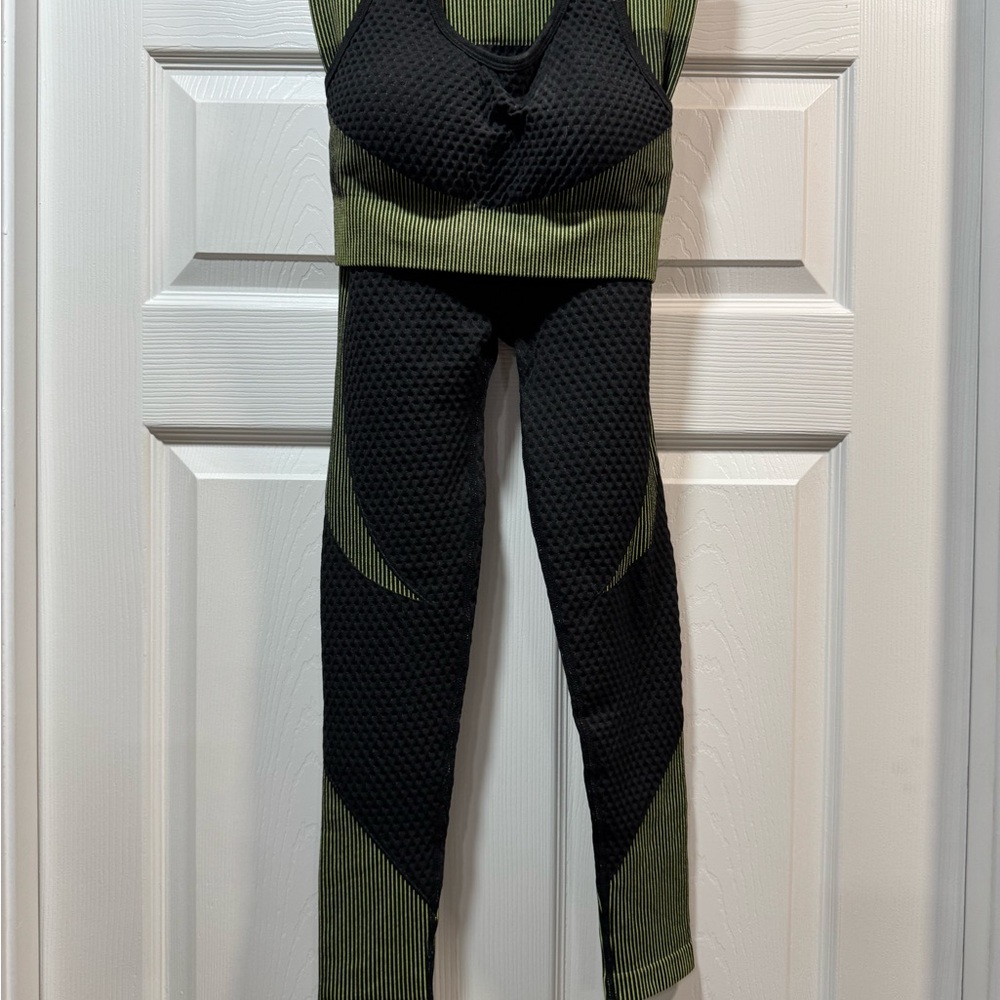 Sleek Black and Green Sports Bras and Leggings Set with Streamlined Fit